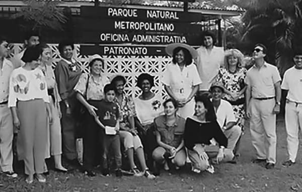 People in front of park sign